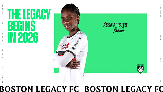 Aïssata Traoré smiles with her arms crossed