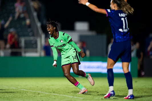 Legacy players run down the field after scoring against the Portland Thorns