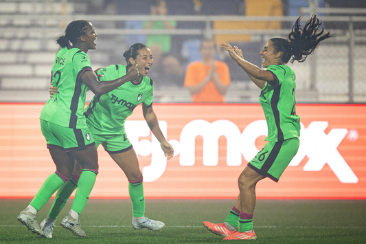 Nichelle Prince celebrates with teammates after scoring against the Chicago Stars